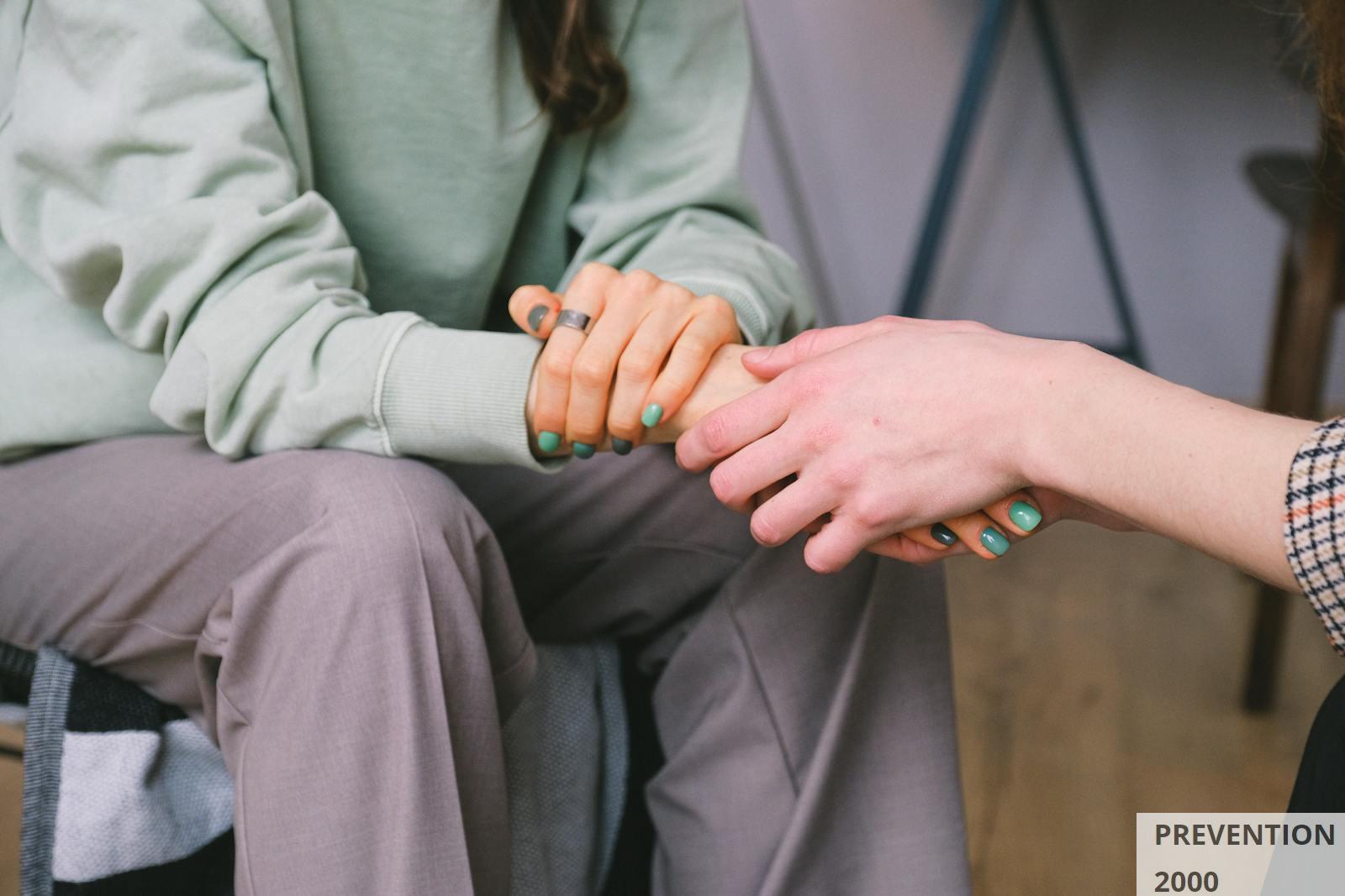Crop psychologist supporting patient during counseling indoors